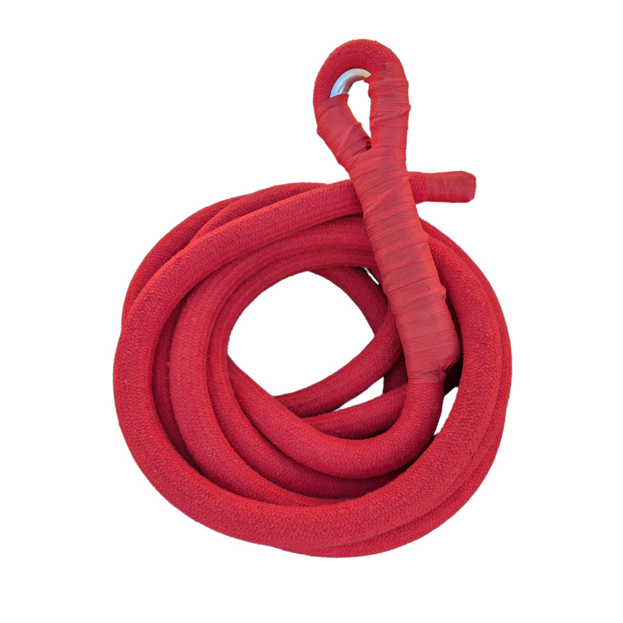 Red corde lisse aerial rope coiled on a white background, spliced eye visible